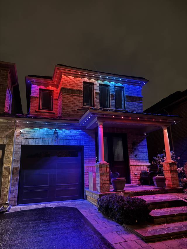 Home with mixed blue, red, and pink permanent LED lighting