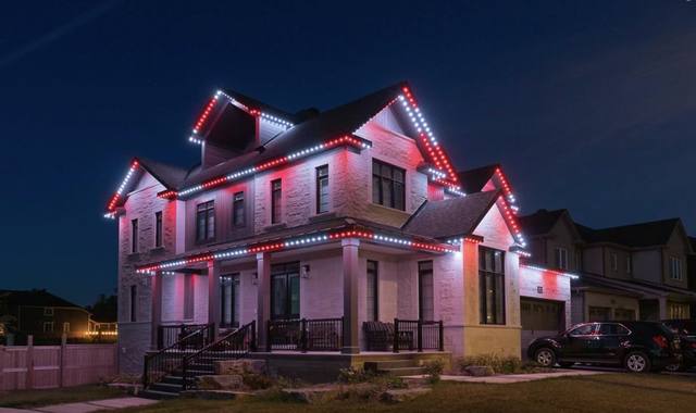 Home with red permanent LED accent lighting for the holidays
