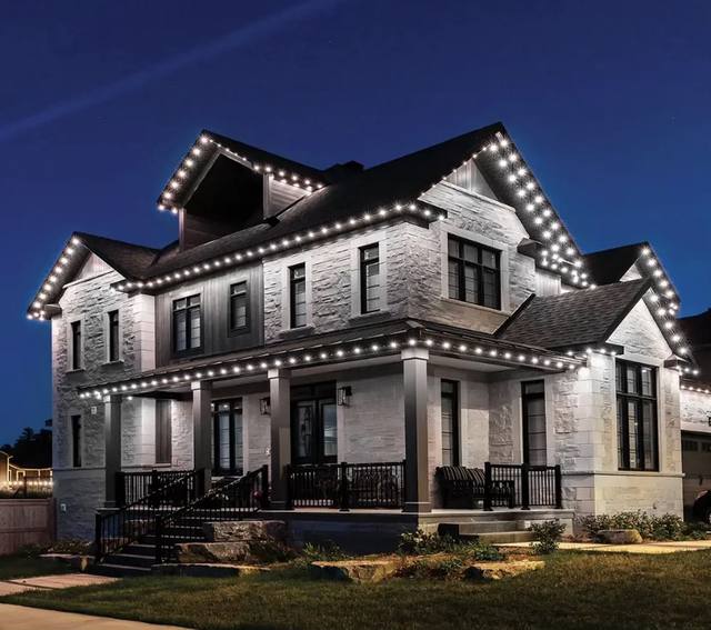 Modern luxury home with bright white permanent LED perimeter lighting